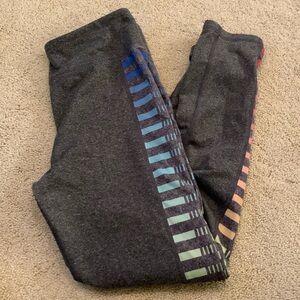 Gray leggings with rainbow stripes down the side